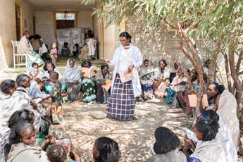 woman leads community-based health education training